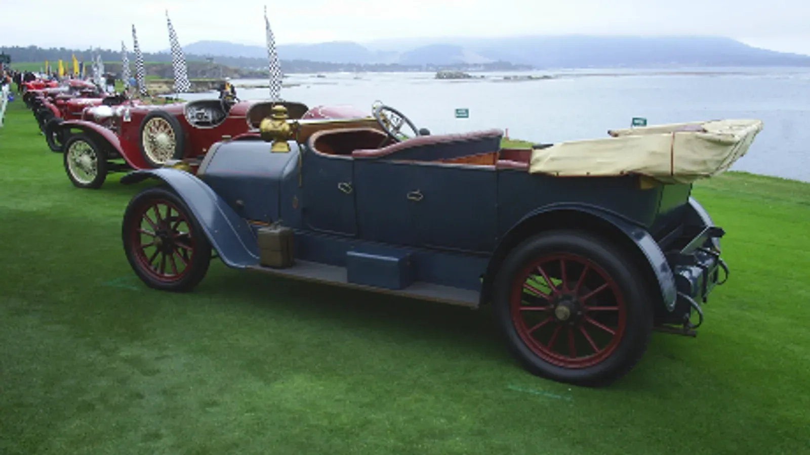 Pre-war collector cars on the show field beside the Pacific Ocean at Pebble Beach Concours in 2005