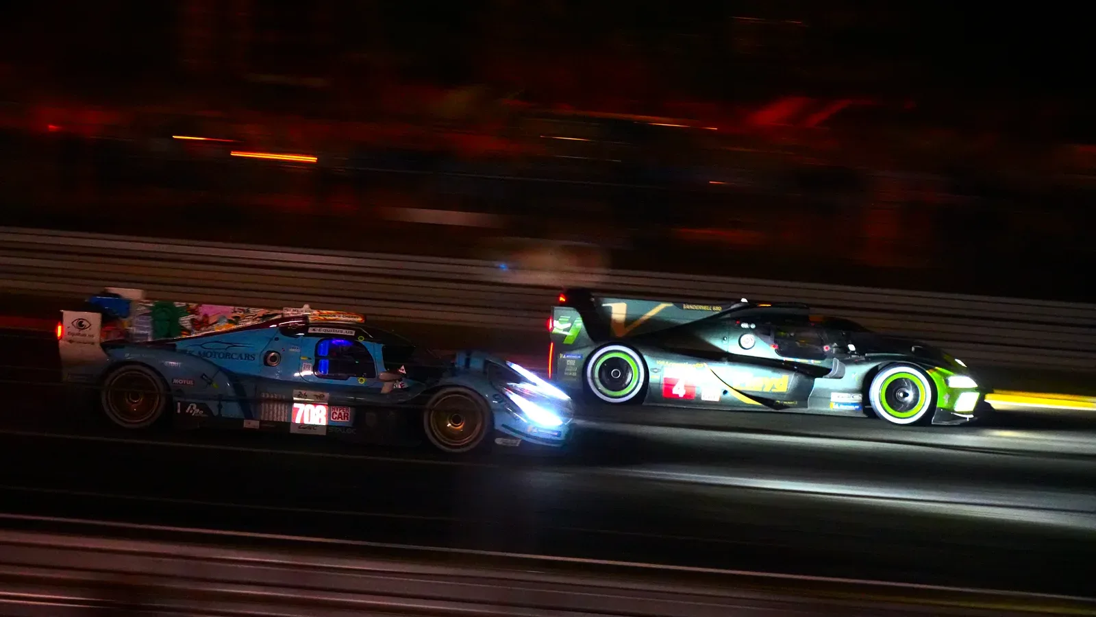 Racing cars on the circuit at night during the 2023 24 Hours of Le Mans