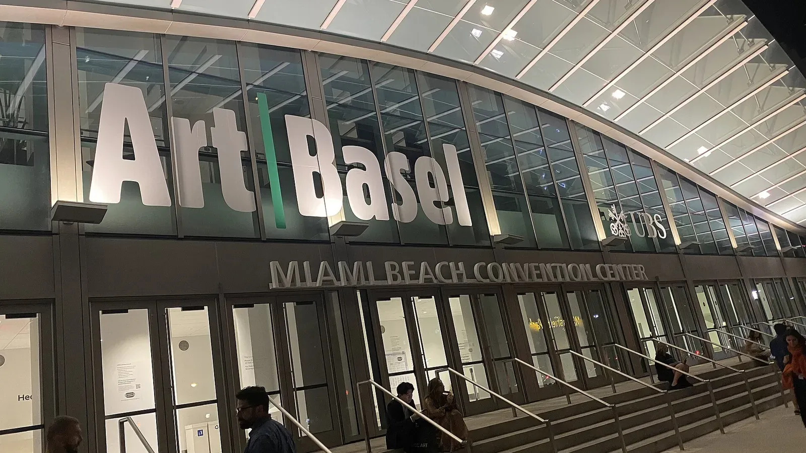 The illuminated Art Basel sign on the Miami Beach Convention Center at night