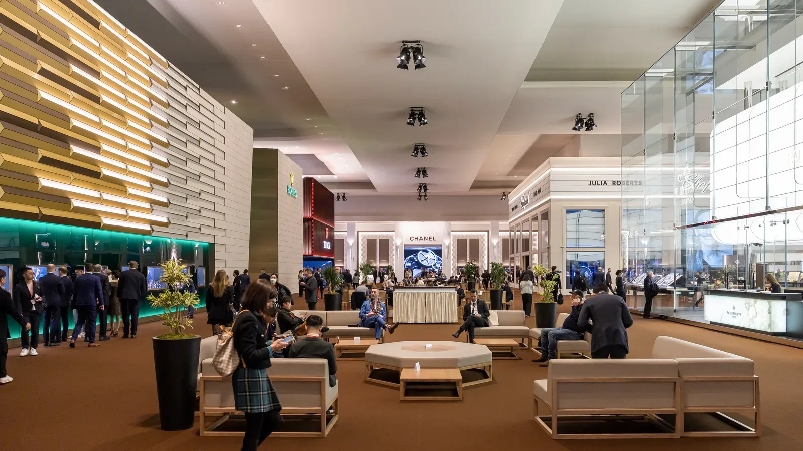 Visitors and watch-brand stands inside Palexpo at Watches and Wonders Geneva in March 2023