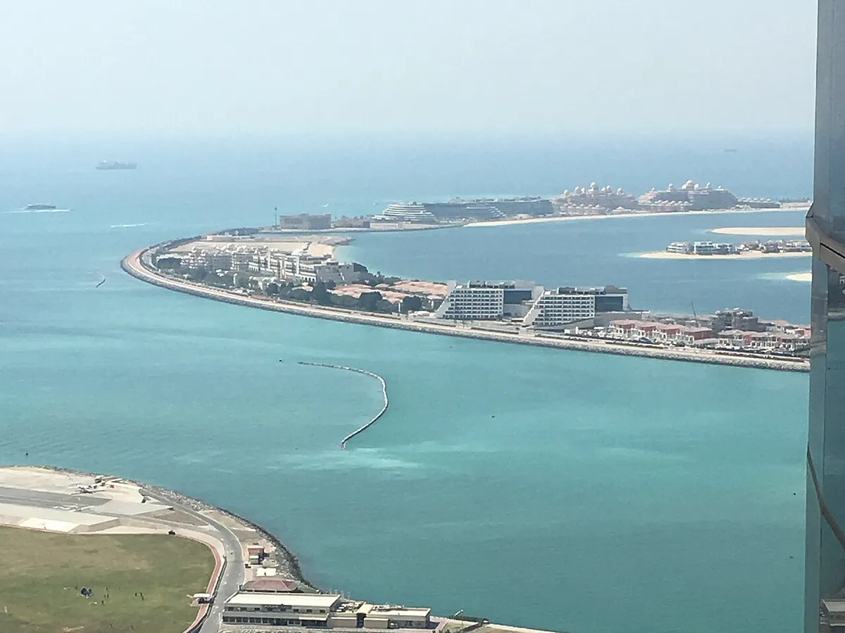 Palm Jumeirah's outer crescent seen from a tower above Dubai Marina