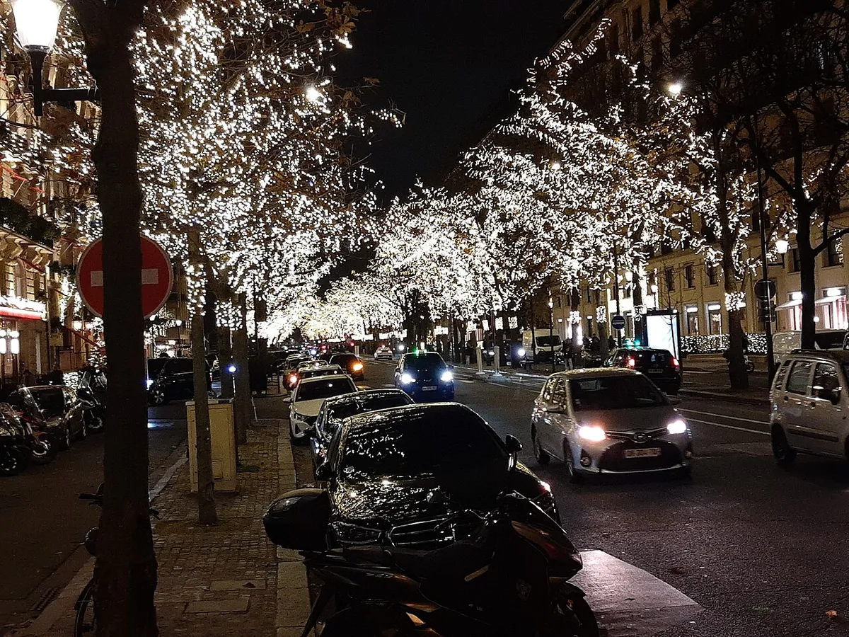 Avenue Montaigne at night with its trees covered in white lights