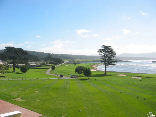 The 18th fairway of Pebble Beach Golf Links running along the shore of Carmel Bay