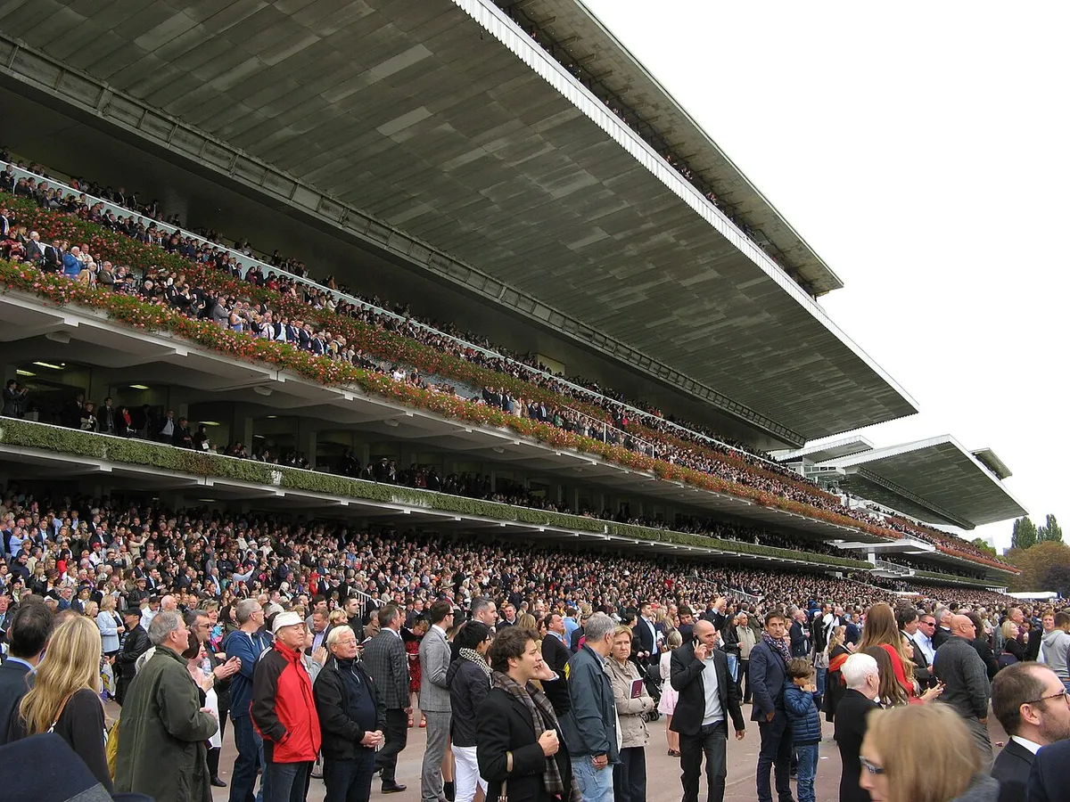 Crowds packing the old grandstands at Longchamp on Arc day