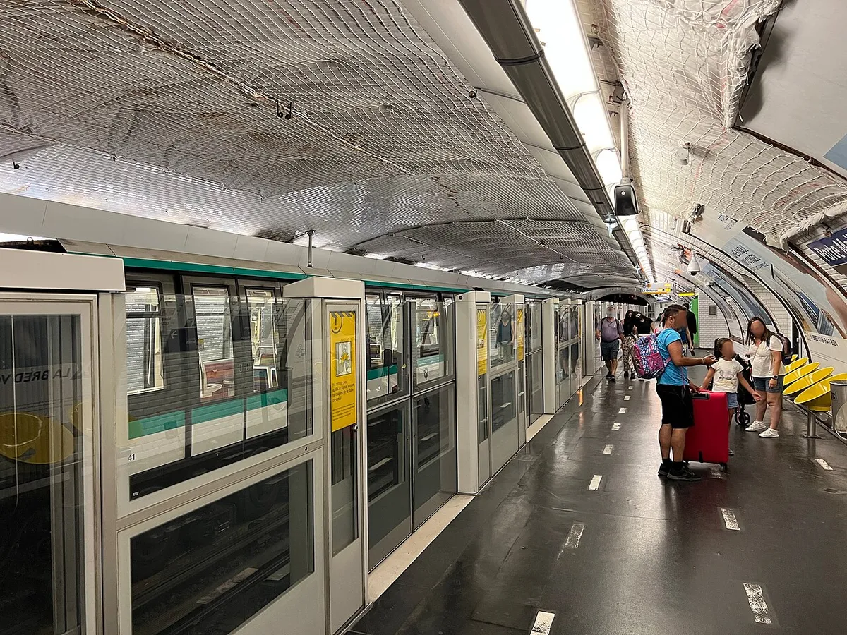 A Paris Métro line 1 train with platform screen doors at Porte Maillot station