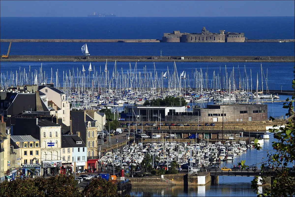 Cherbourg's houses above Port Chantereyne marina, with the harbour breakwater and fort beyond