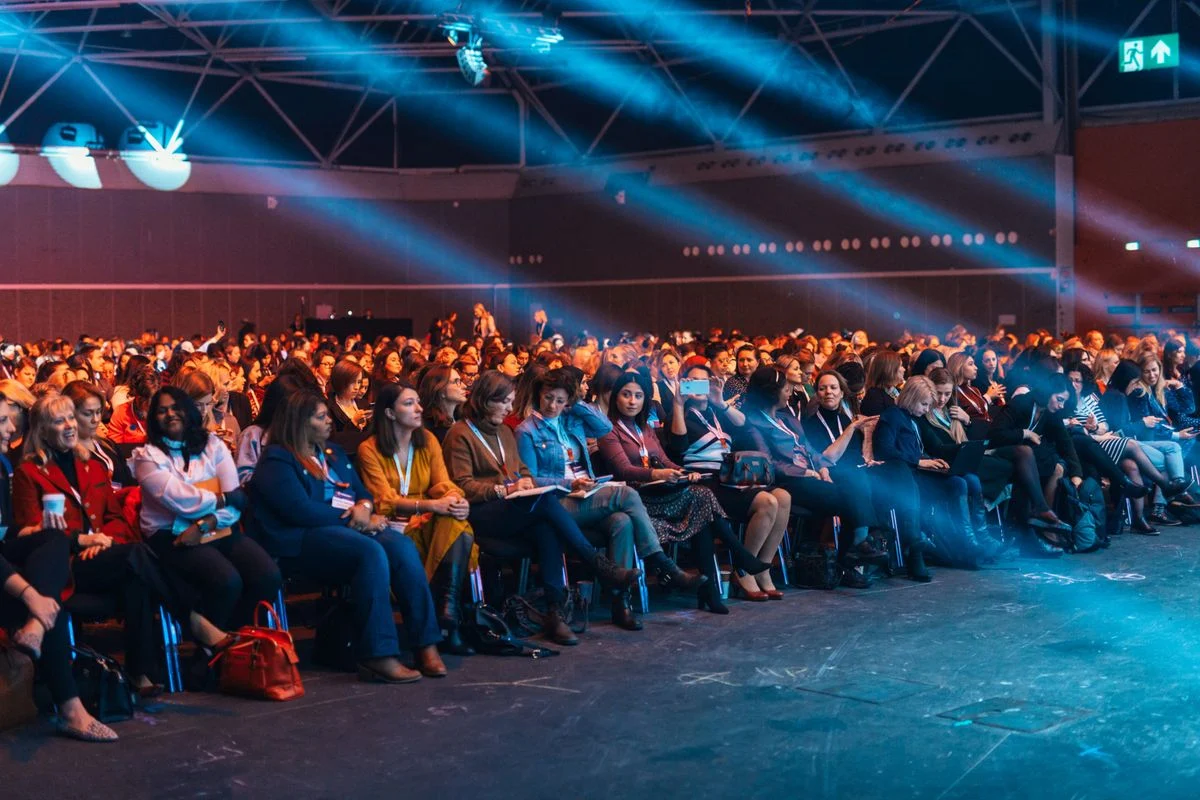 An audience gathered for an indoor event