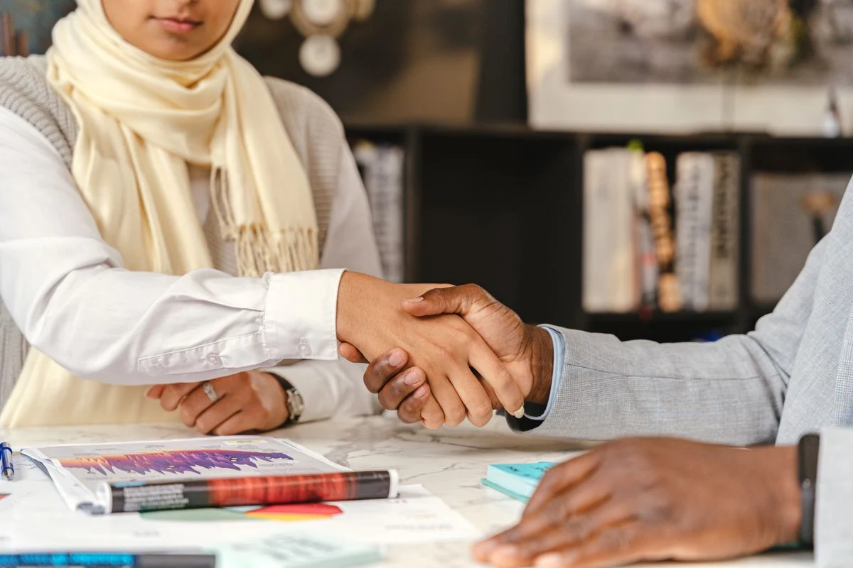 Businesspeople shaking hands during a meeting